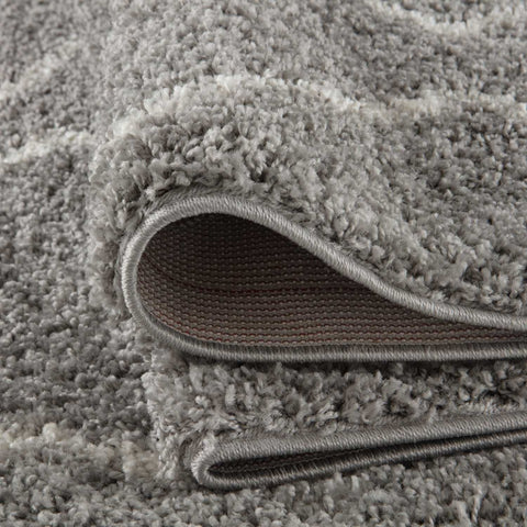 A plush moroccan grey shaggy rug with dense fluffy texture and neatly finished edges perfect for cozy spaces