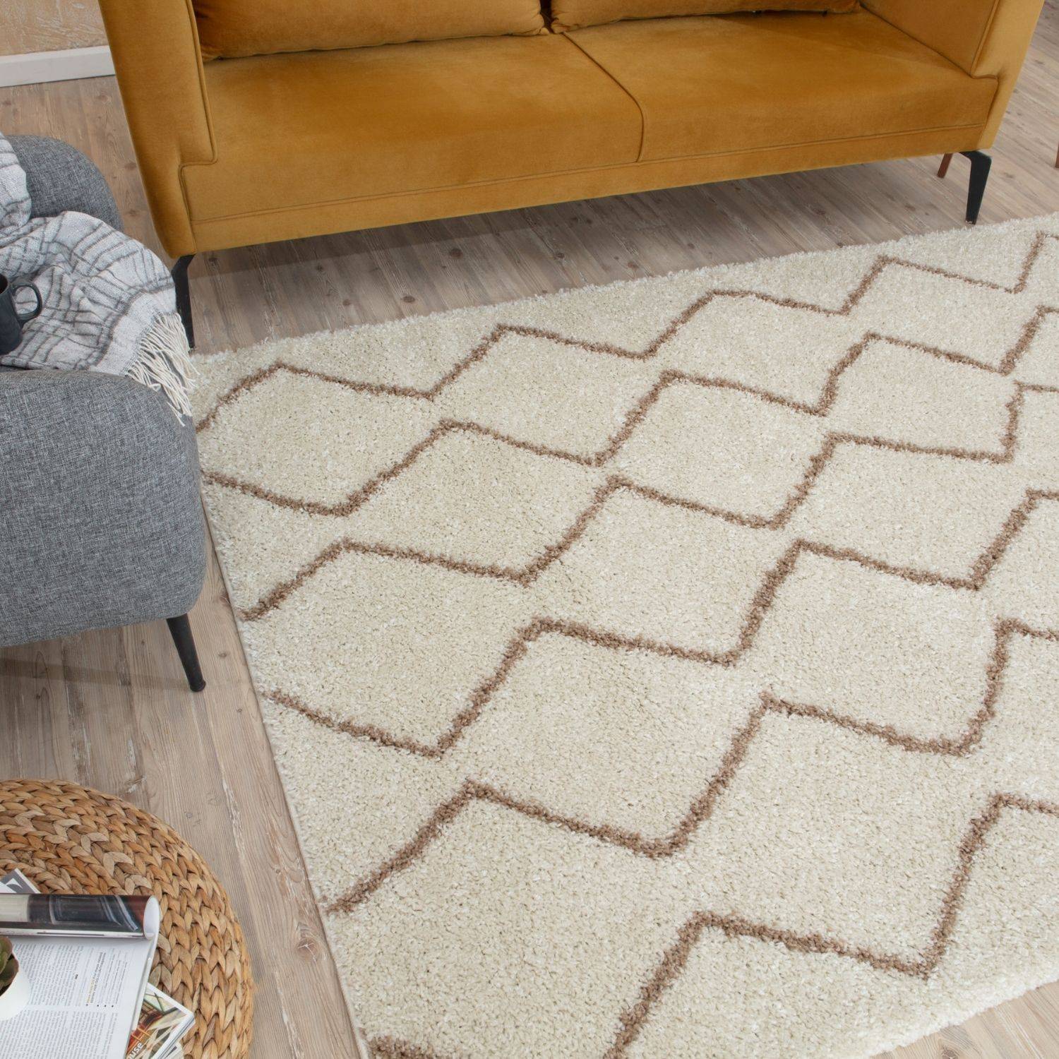 Moroccan ivory beige shaggy rug with cream color and muted brown geometric zigzag pattern perfect for cozy spaces