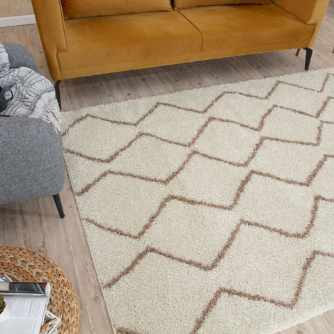 Moroccan ivory beige shaggy rug with cream color and muted brown geometric zigzag pattern perfect for cozy spaces
