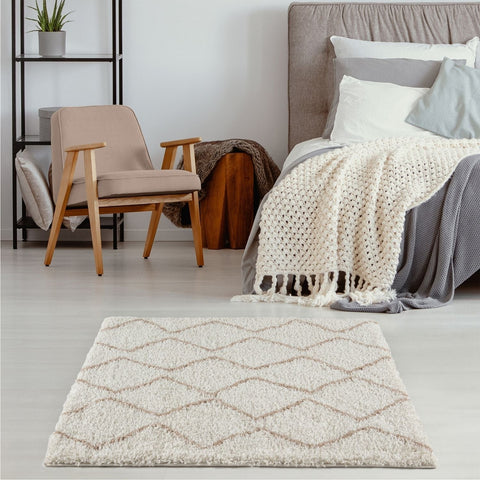 Cream-colored moroccan ivory beige shaggy rug with a subtle beige geometric diamond pattern for cozy spaces