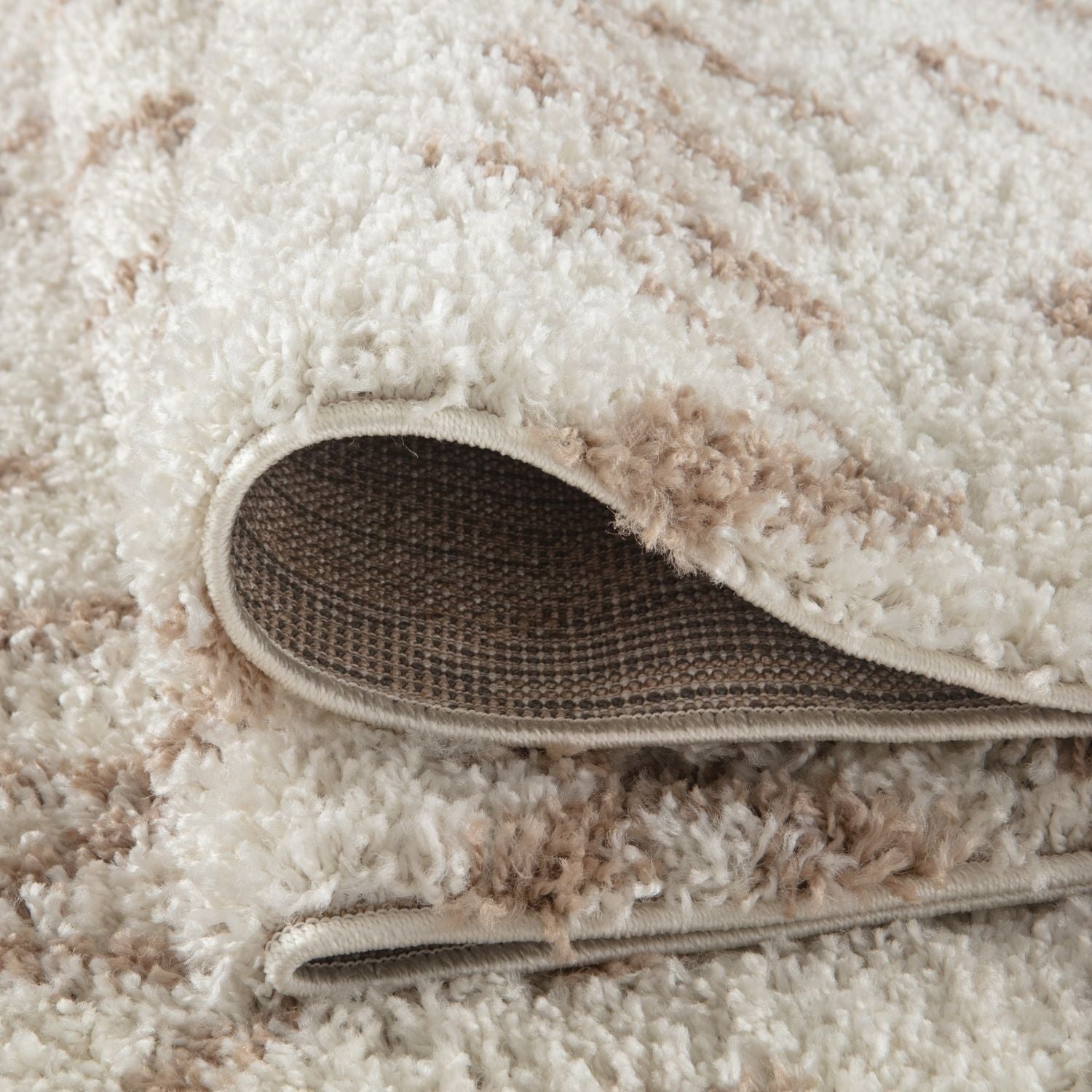 Cream and beige moroccan ivory beige shaggy rug with plush textured surface perfect for cozy living spaces