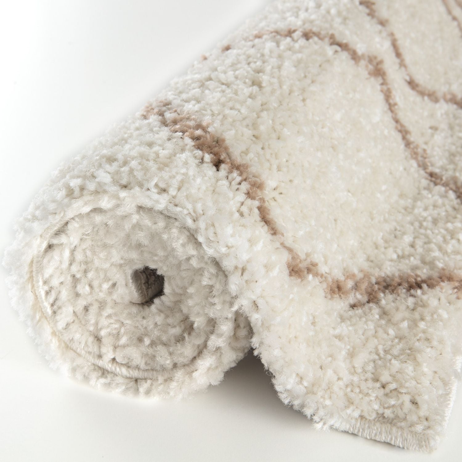 A moroccan ivory beige shaggy rug with soft textured fibers and subtle beige geometric patterns for cozy spaces