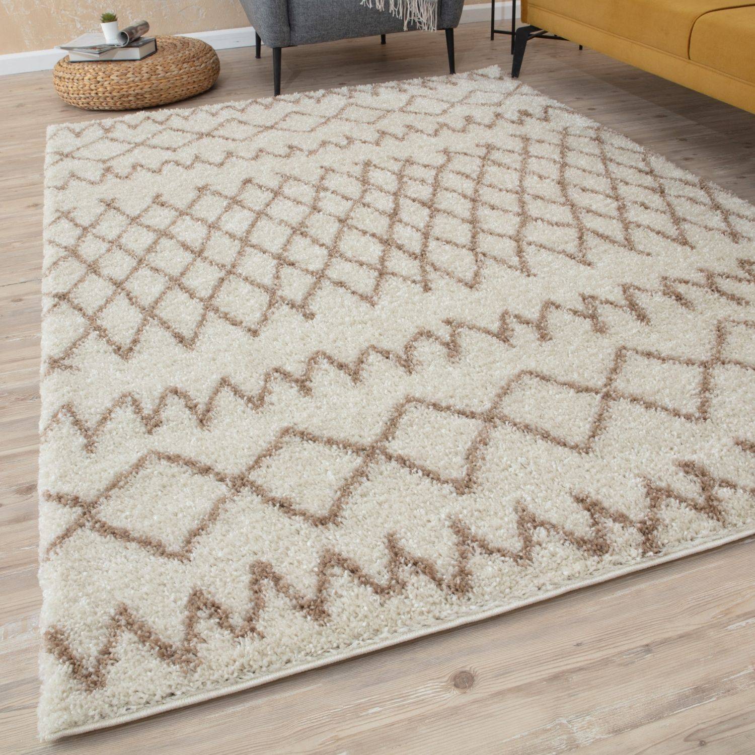 Moroccan ivory beige shaggy rug with geometric diamond and zigzag patterns in soft ivory beige tones