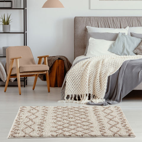 Moroccan ivory beige shaggy rug with beige and gray geometric pattern and plush textured surface