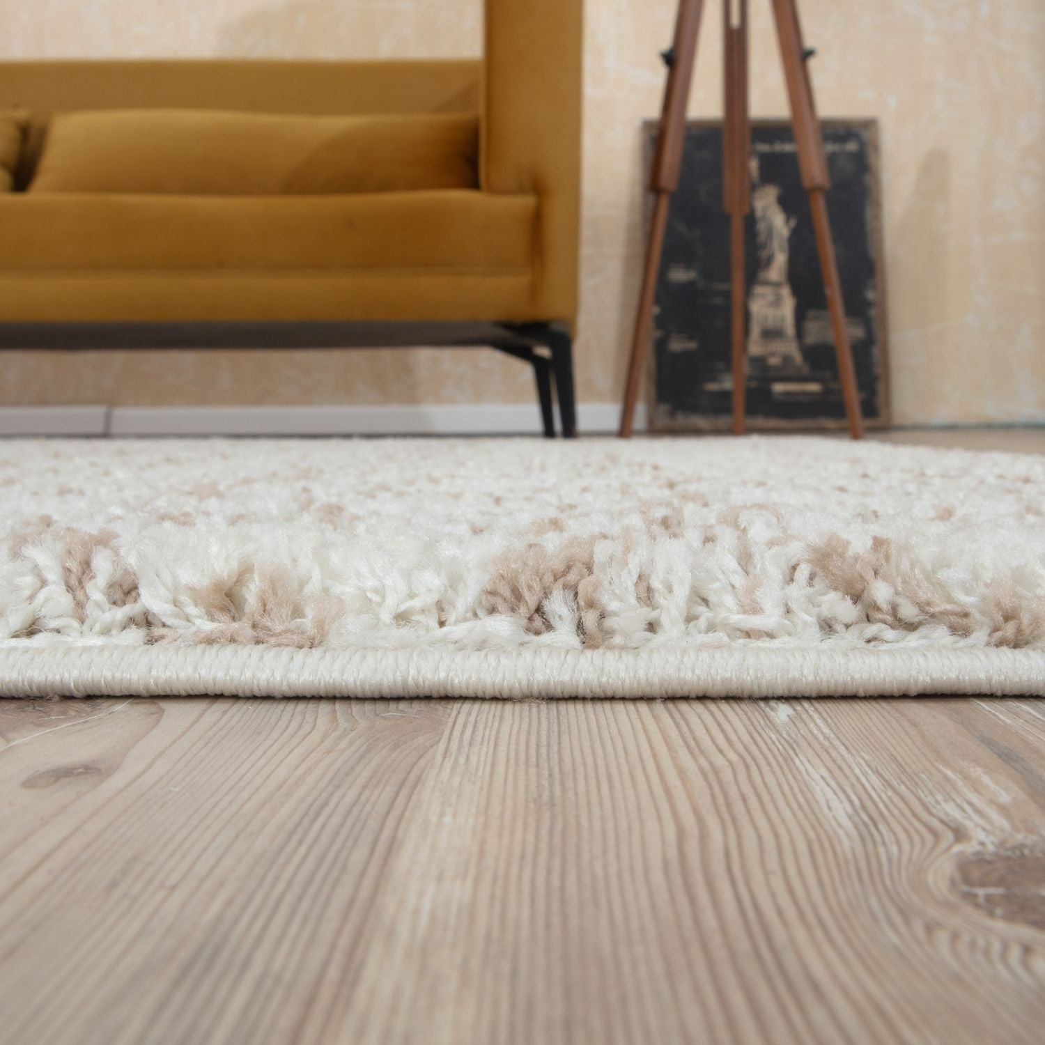 A moroccan ivory beige shaggy rug with a plush cream-colored textured surface and neatly finished edges