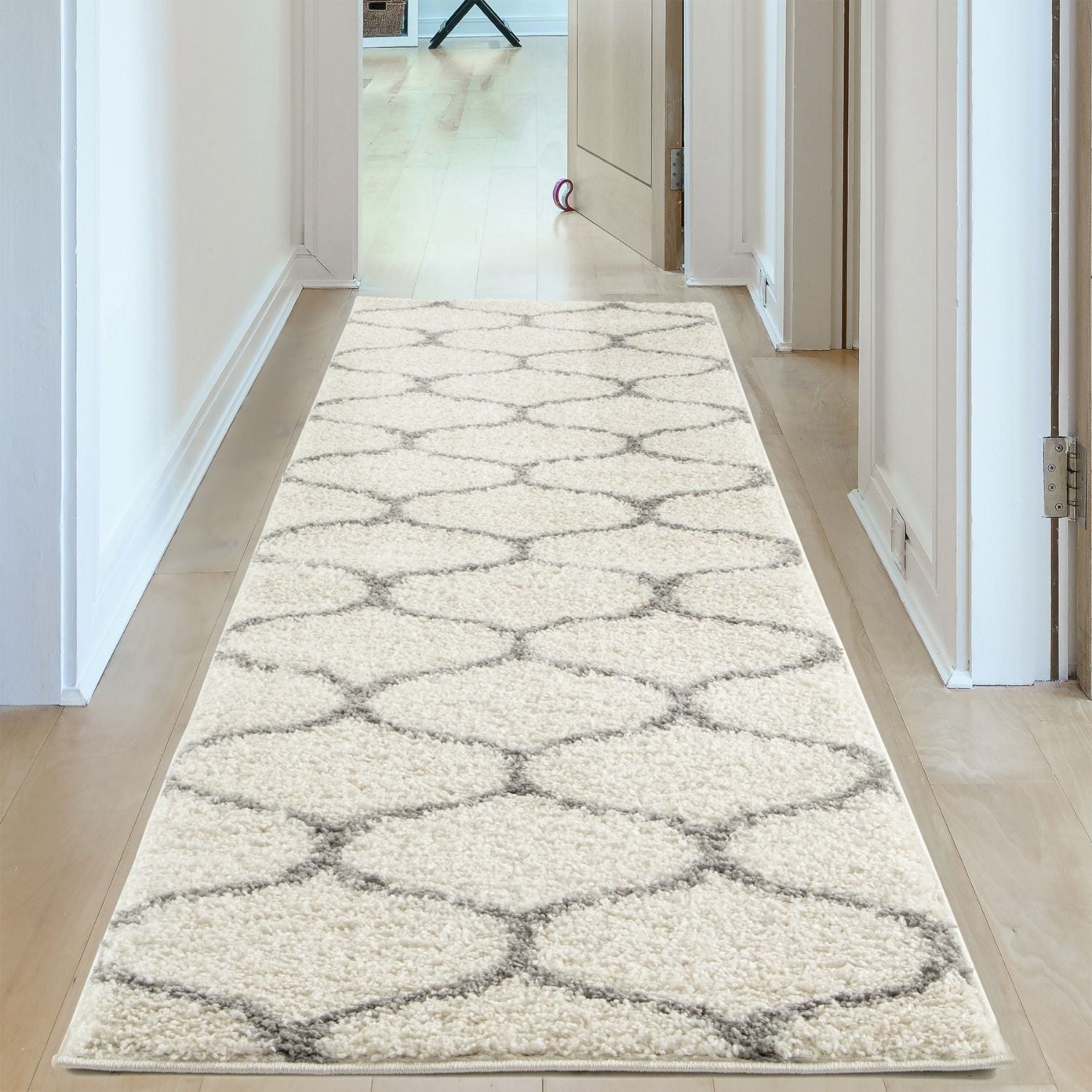 Moroccan ivory shaggy runner rug in cream with a geometric gray pattern perfect for cozy home decor