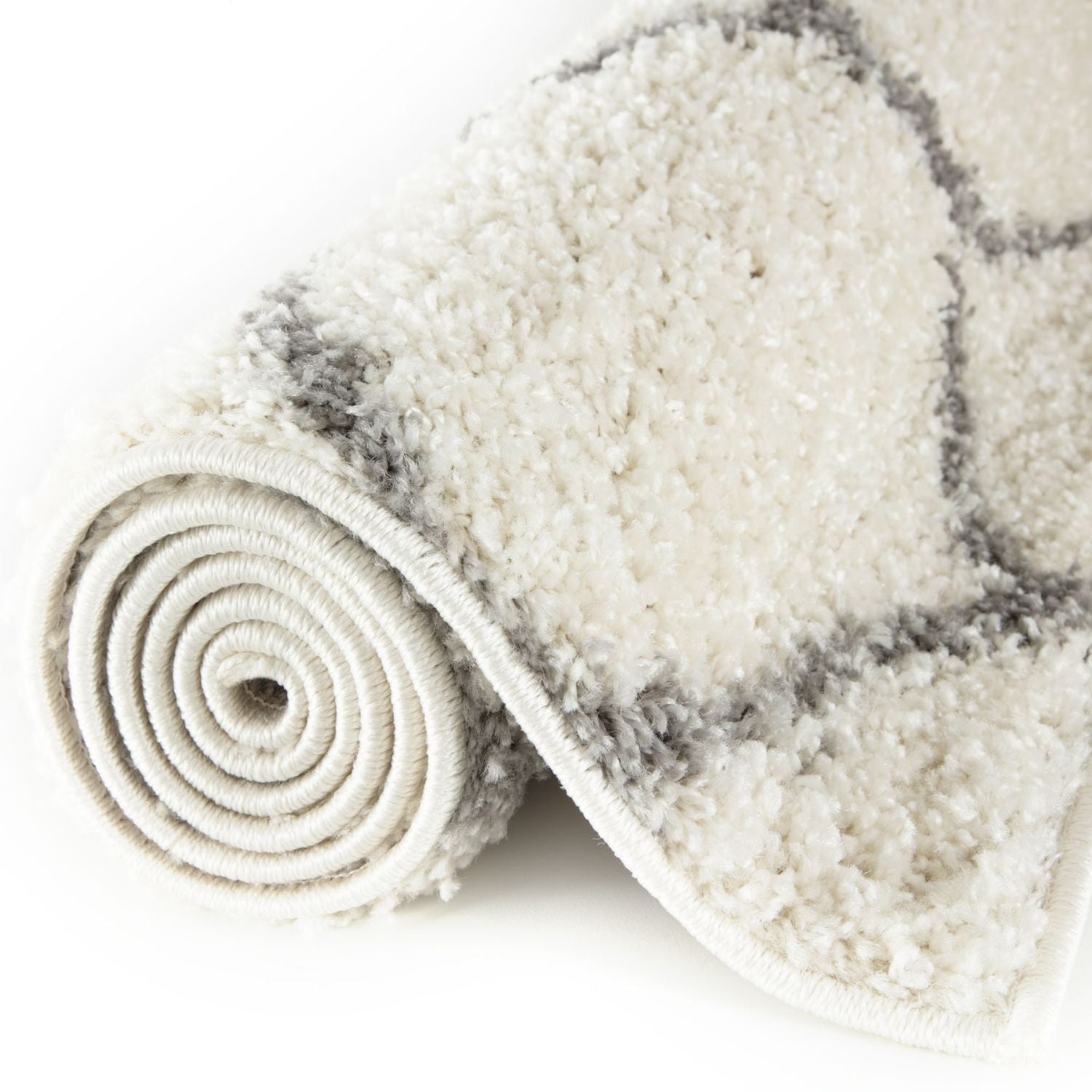 A moroccan ivory shaggy rug with soft cream color and subtle gray geometric patterns for cozy home decor