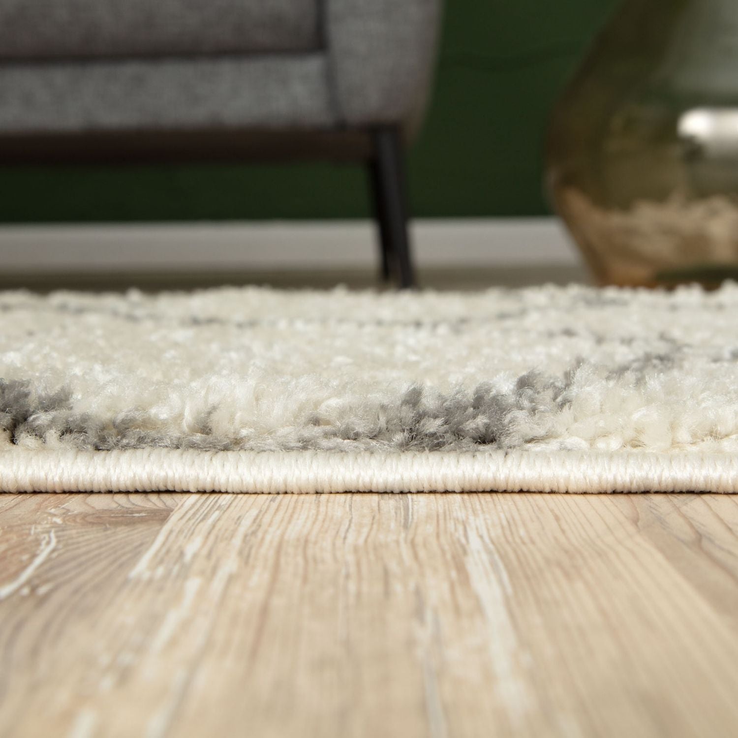 A plush moroccan ivory shaggy rug with a fluffy textured surface in cream and gray perfect for cozy spaces