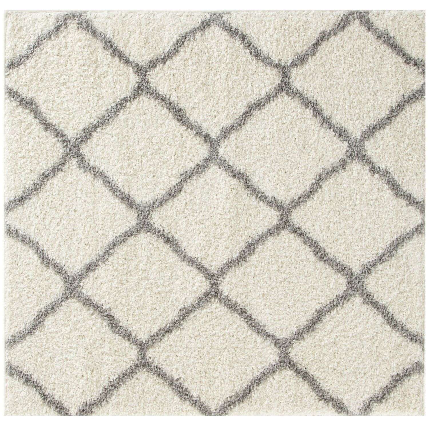 Moroccan ivory shaggy rug with a soft cream-colored shag surface and dark gray geometric diamond pattern