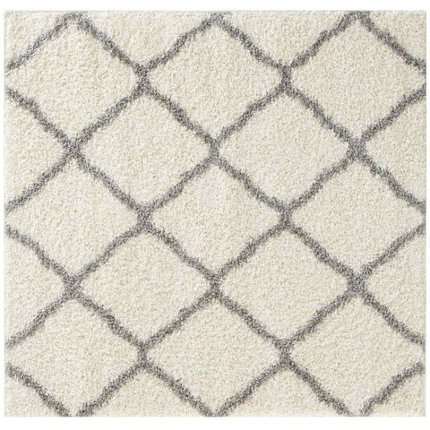 Moroccan ivory shaggy rug with a soft cream-colored shag surface and dark gray geometric diamond pattern
