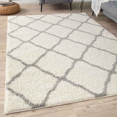Moroccan ivory shaggy rug in cream with a geometric diamond pattern in muted gray perfect for cozy spaces
