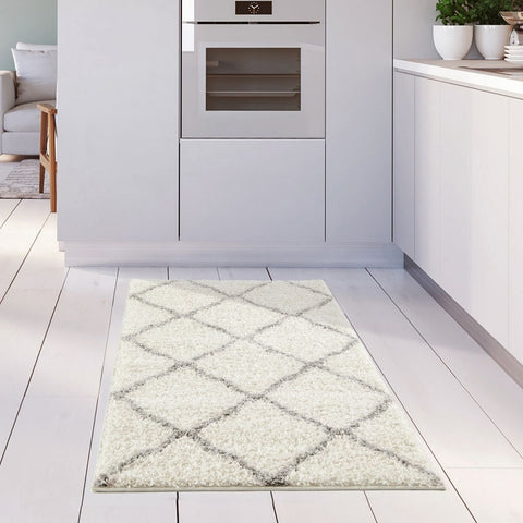 Moroccan ivory shaggy rug featuring a cream-colored shaggy texture with a gray geometric diamond pattern