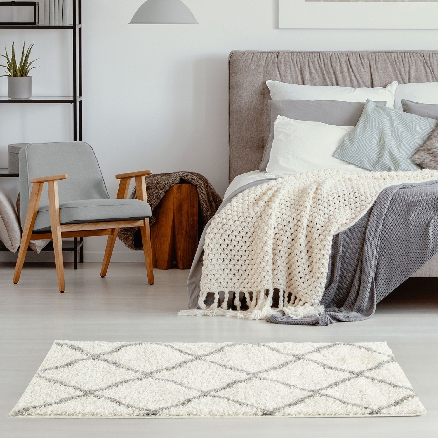 Cream-colored moroccan ivory shaggy rug with a geometric gray diamond pattern for cozy home decor
