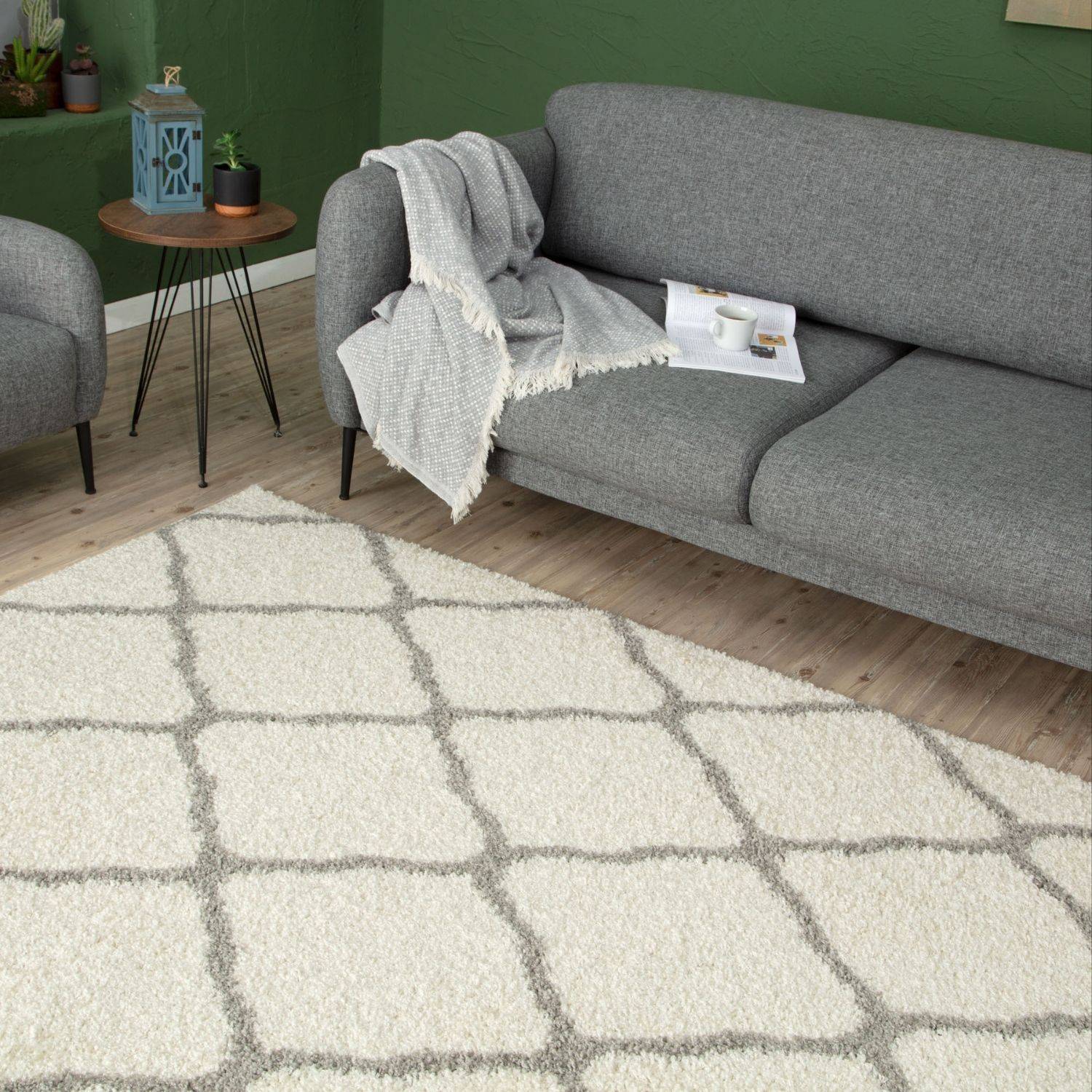 Moroccan ivory shaggy rug with a cream-colored shag and geometric gray grid pattern for cozy decor