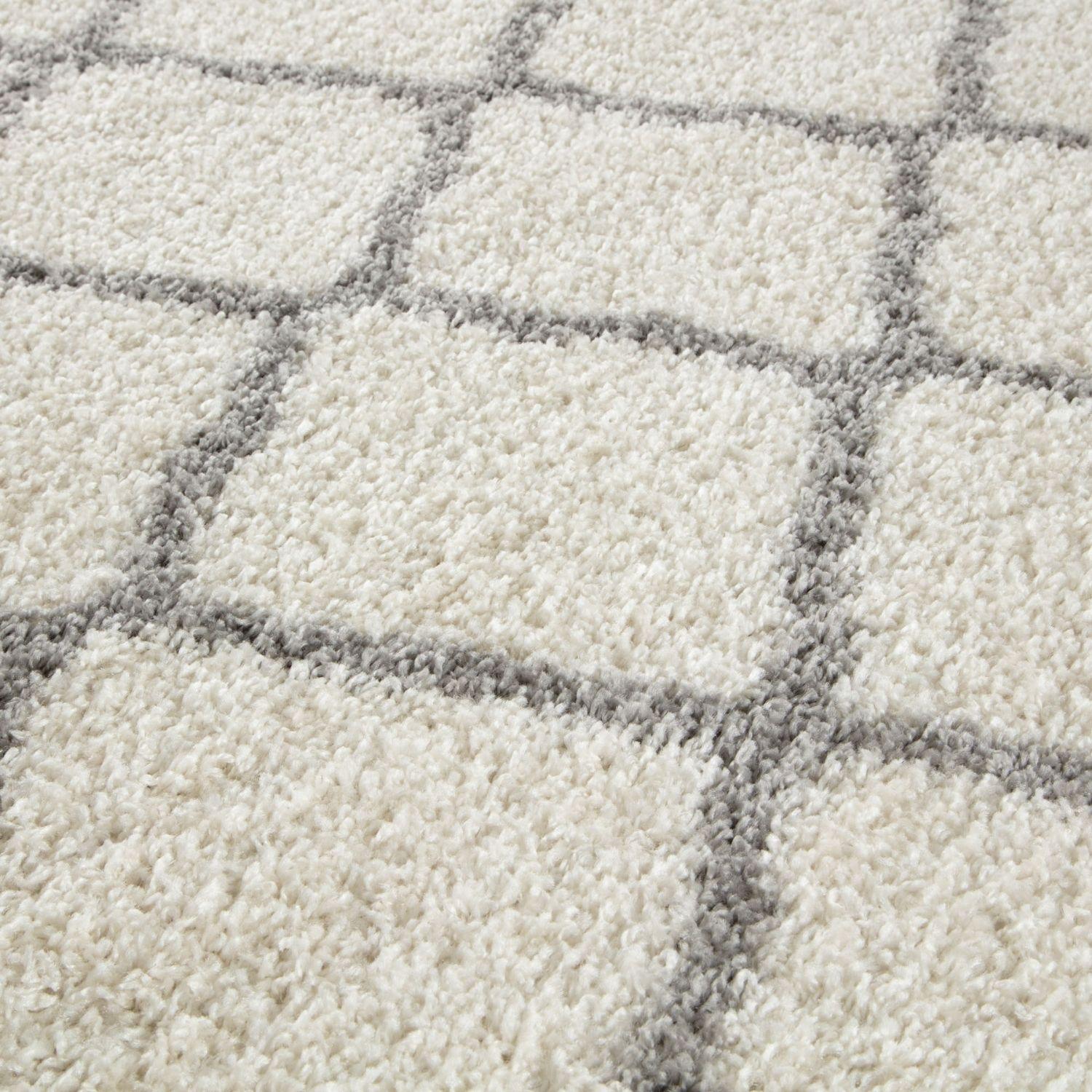 Moroccan ivory shaggy rug with cream color, soft plush texture, and subtle gray geometric grid pattern
