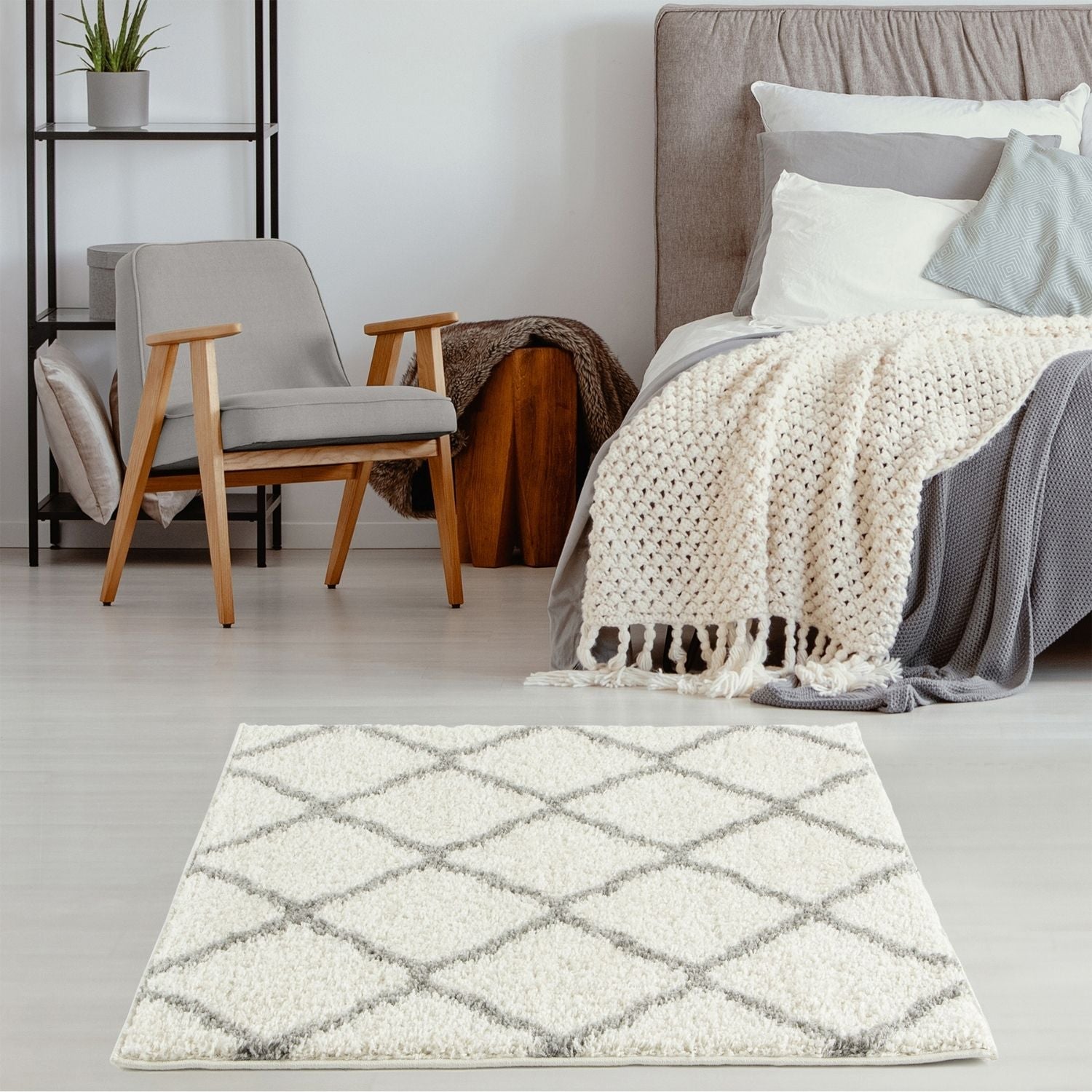 A plush moroccan ivory shaggy rug with a white and gray diamond pattern perfect for cozy living spaces
