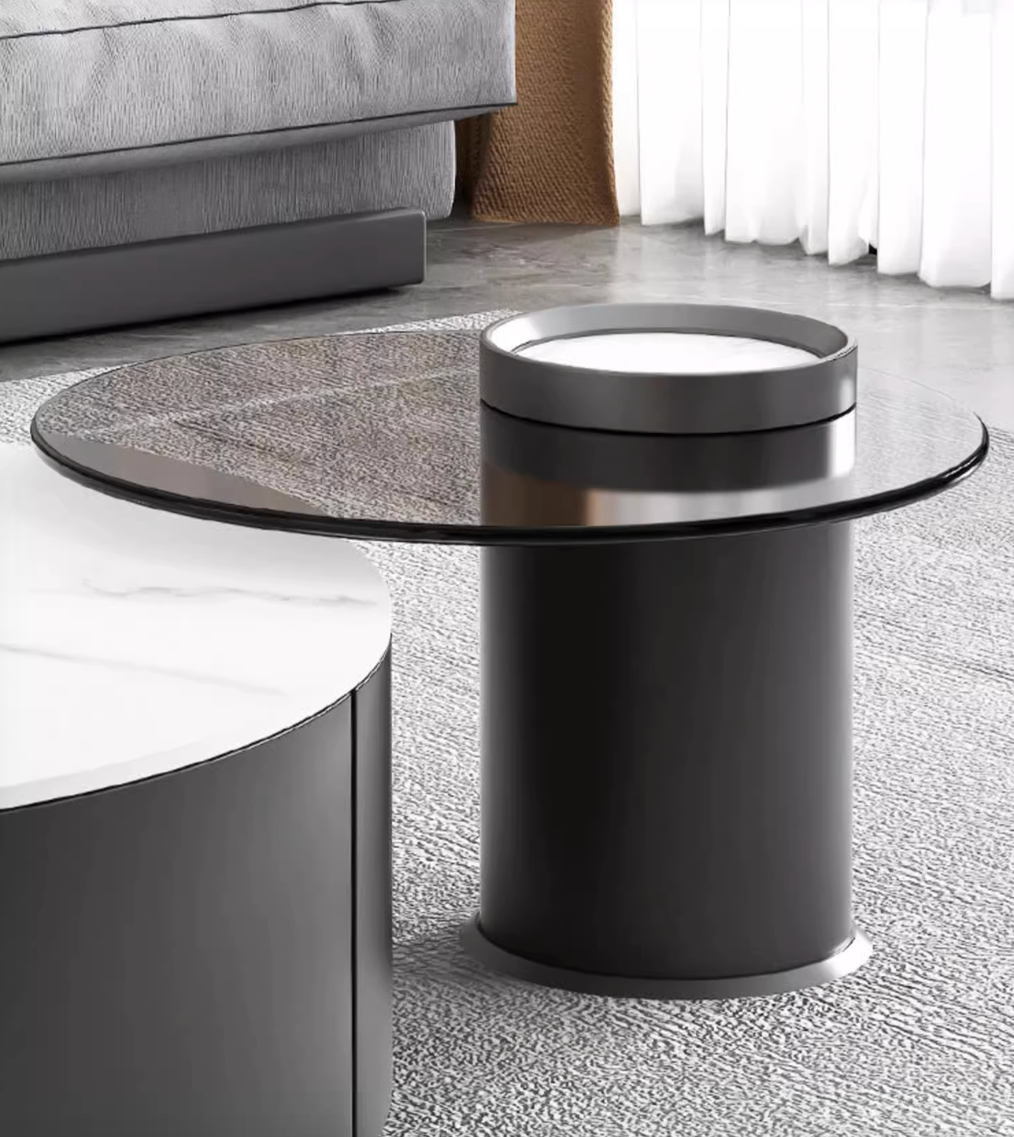 Black cylindrical coffee table with round glass top and matching lid in mosaic round nesting coffee table set with ottoman
