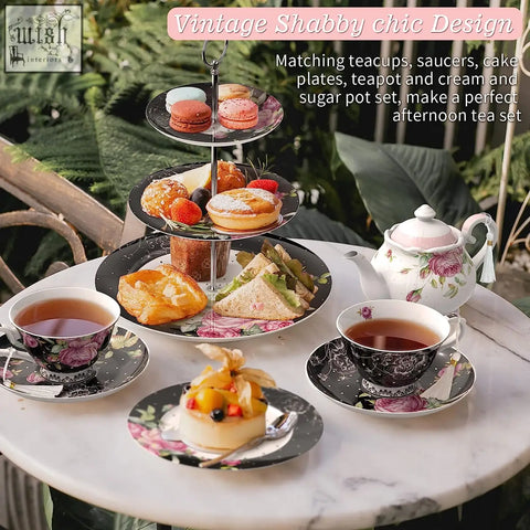 Vintage shabby chic black floral tier cake stand with assorted pastries tea cups and gift box for mothers day party
