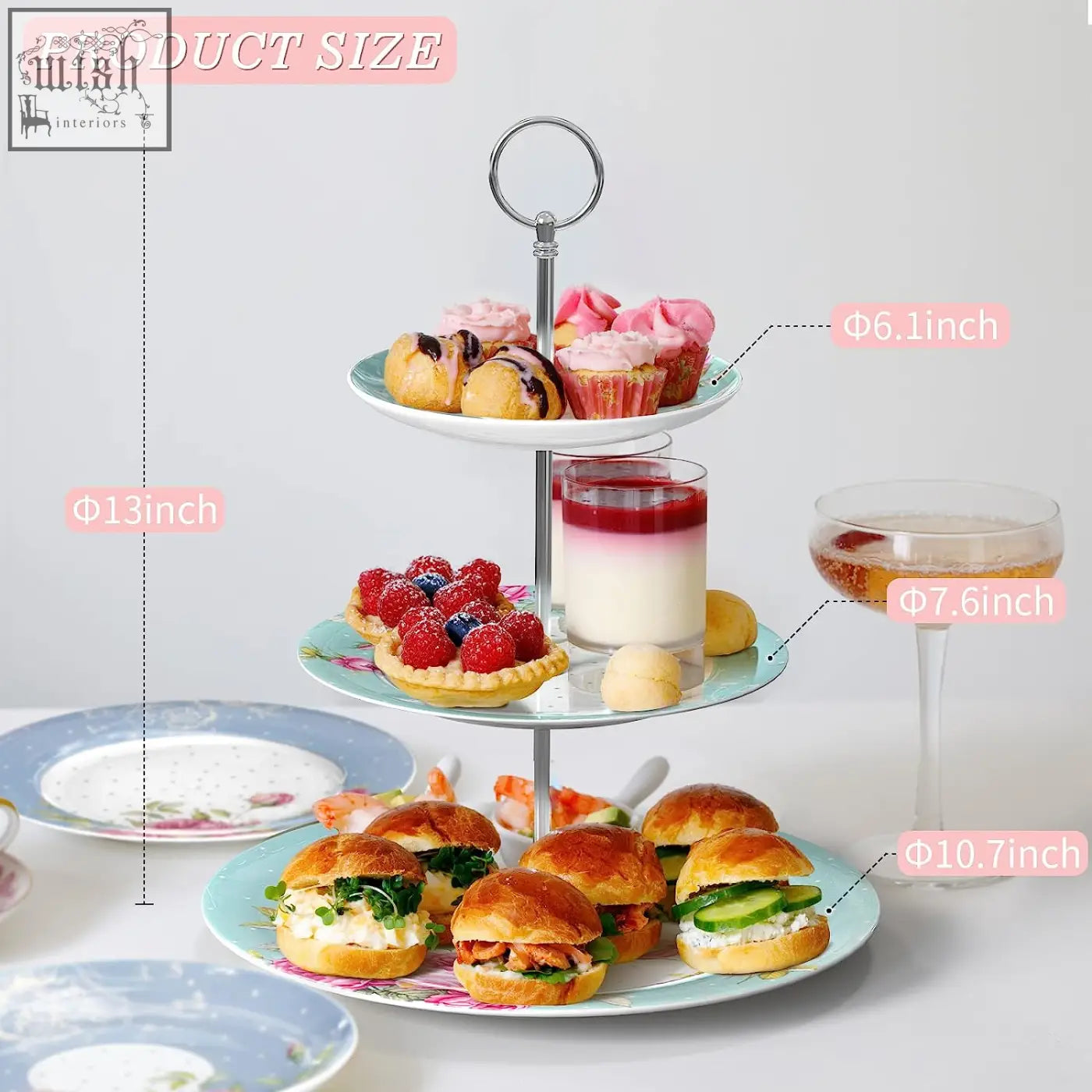 Three-tiered turquoise tier cake stand with slender metal frame and floral light blue ceramic plates for family parties