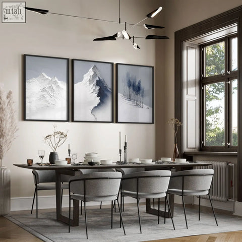 Modern dining room with dark wood table and gray chairs featuring mountain painting three prints wall art set