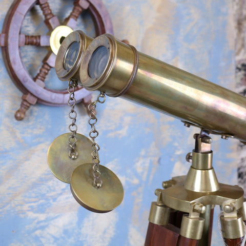 Antique brass mowai vintage binoculars with wooden tripod base and hanging circular discs for classic style display