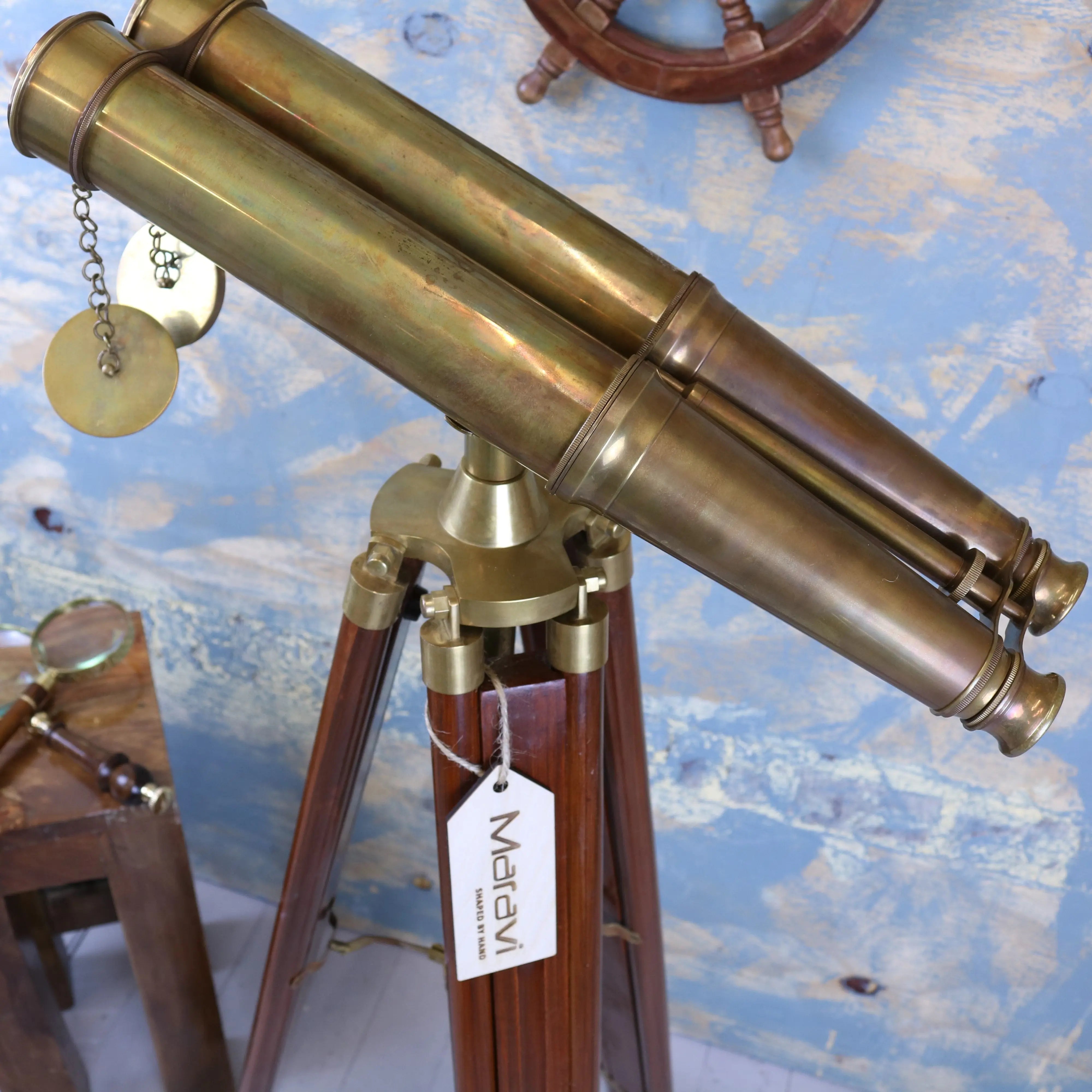 Antique brass mowai vintage binoculars mounted on wooden tripod with marev tag vintage binoculars close up