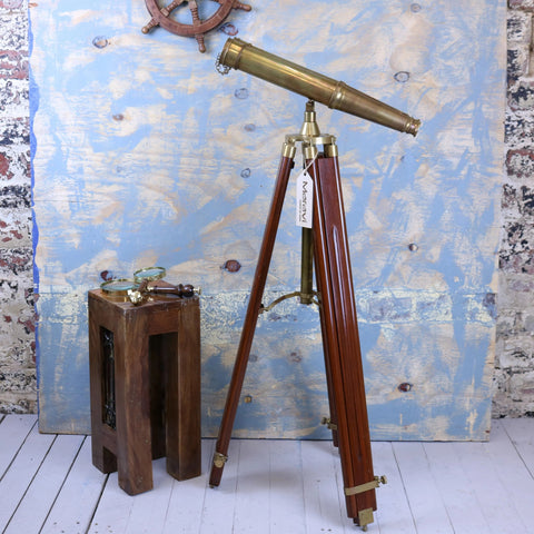 Antique brass mowai vintage binoculars mounted on polished wooden tripod for classic decor and display