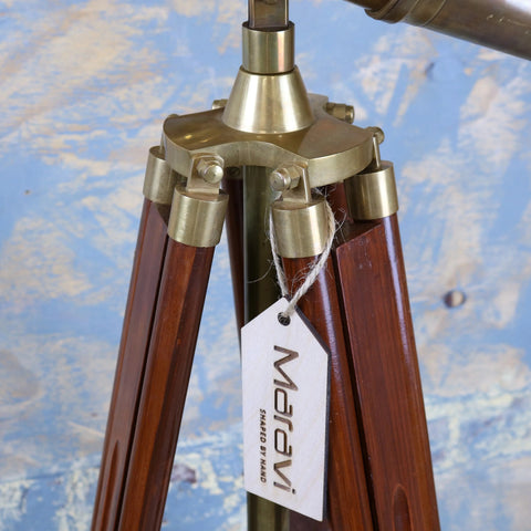 A brass-finished vintage binocular tripod with rich dark wood legs showcasing mowai vintage binoculars style