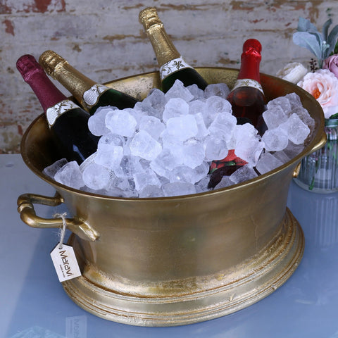 Gold-colored metallic moyar champagne bucket large ice bath with ornate handles and distressed finish
