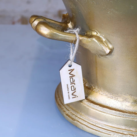 Golden metallic moyar champagne bucket large ice bath with ornate sculpted handles and textured distressed gold surface