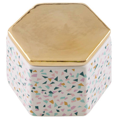 Hexagonal ceramic pattern storage jar with terrazzo pattern, gold lid, and colorful geometric design on white body