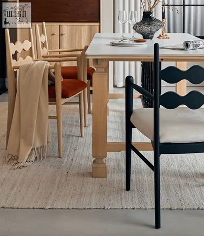 Black wavy-back mucha dining chair with cream cushion perfect as a stylish dining chair option