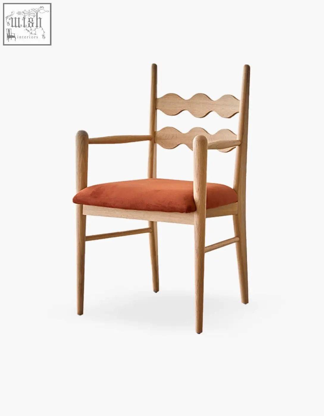A light wood mucha dining chair with a scalloped backrest and orange upholstered seat perfect as a dining chair