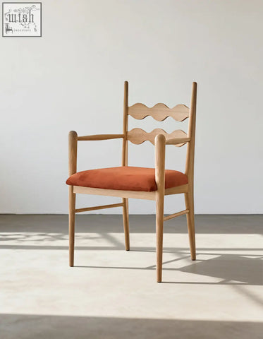 A light wood mucha dining chair with a wavy backrest and orange upholstered seat perfect for dining