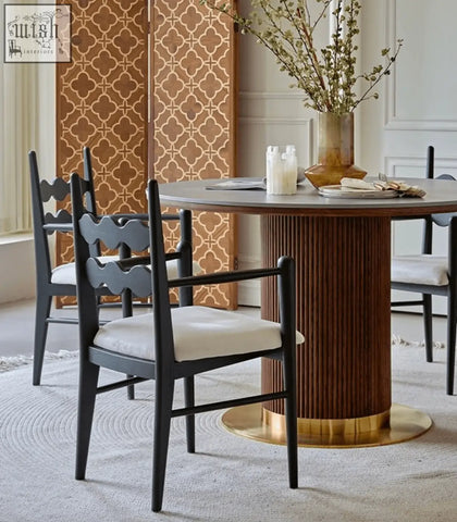 A mucha dining set with a dark wood round table and black scalloped backrest mucha dining chairs