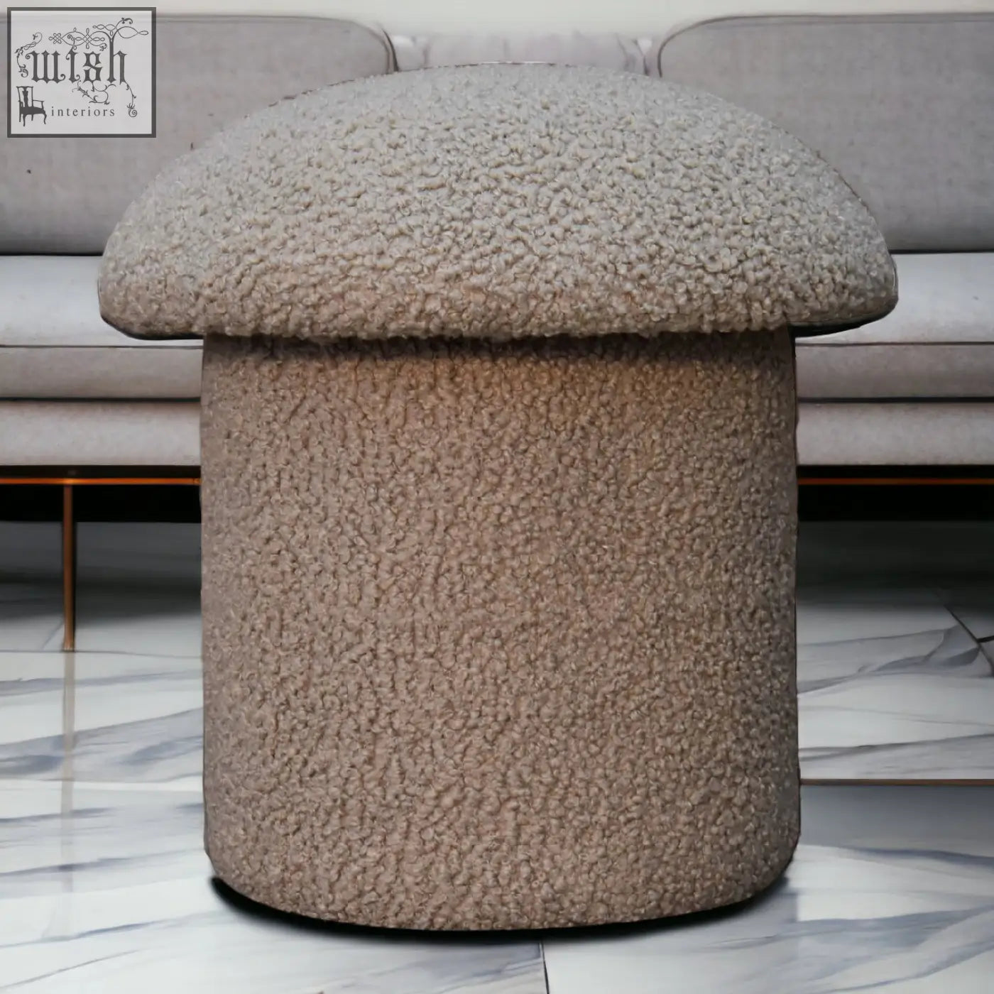 Beige fuzzy mushroom-shaped ottoman made with soft mud boucle fabric featuring a plush textured surface