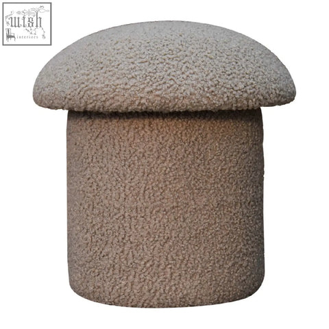 A cozy beige mushroom footstool with rounded top and cylindrical base in soft mud boucle fabric