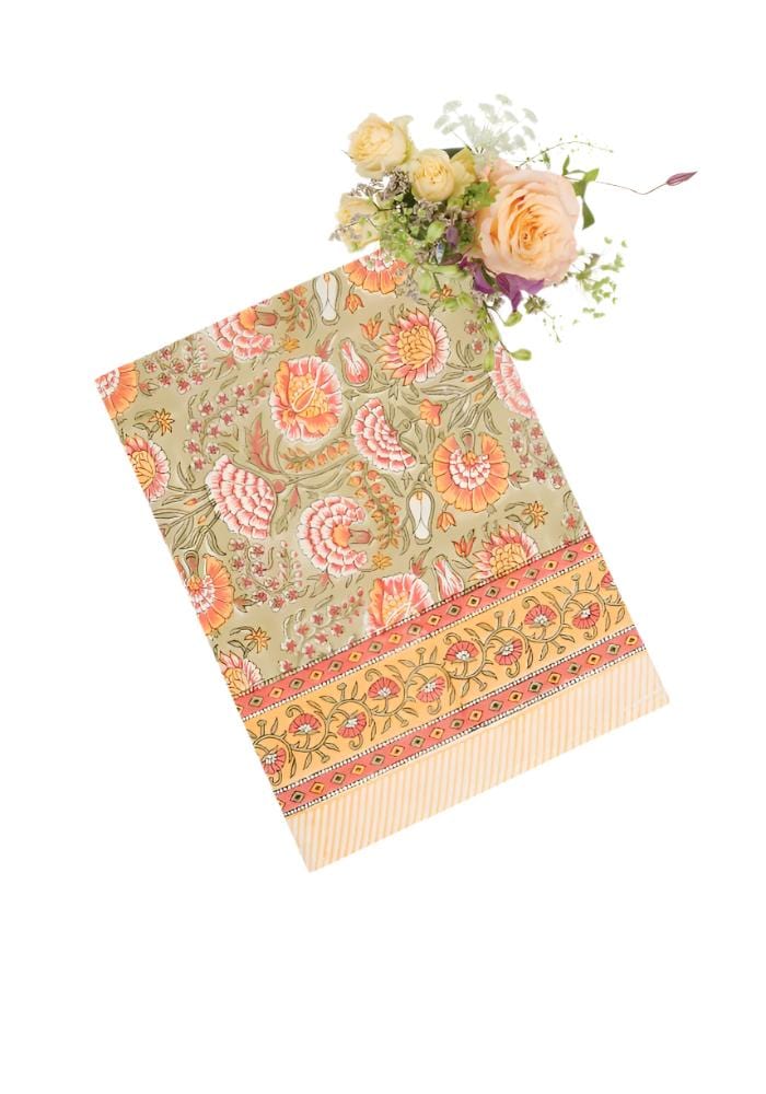 A soft sage green hand towel with mughal rajan floral peach and orange patterns and an ornate botanical border