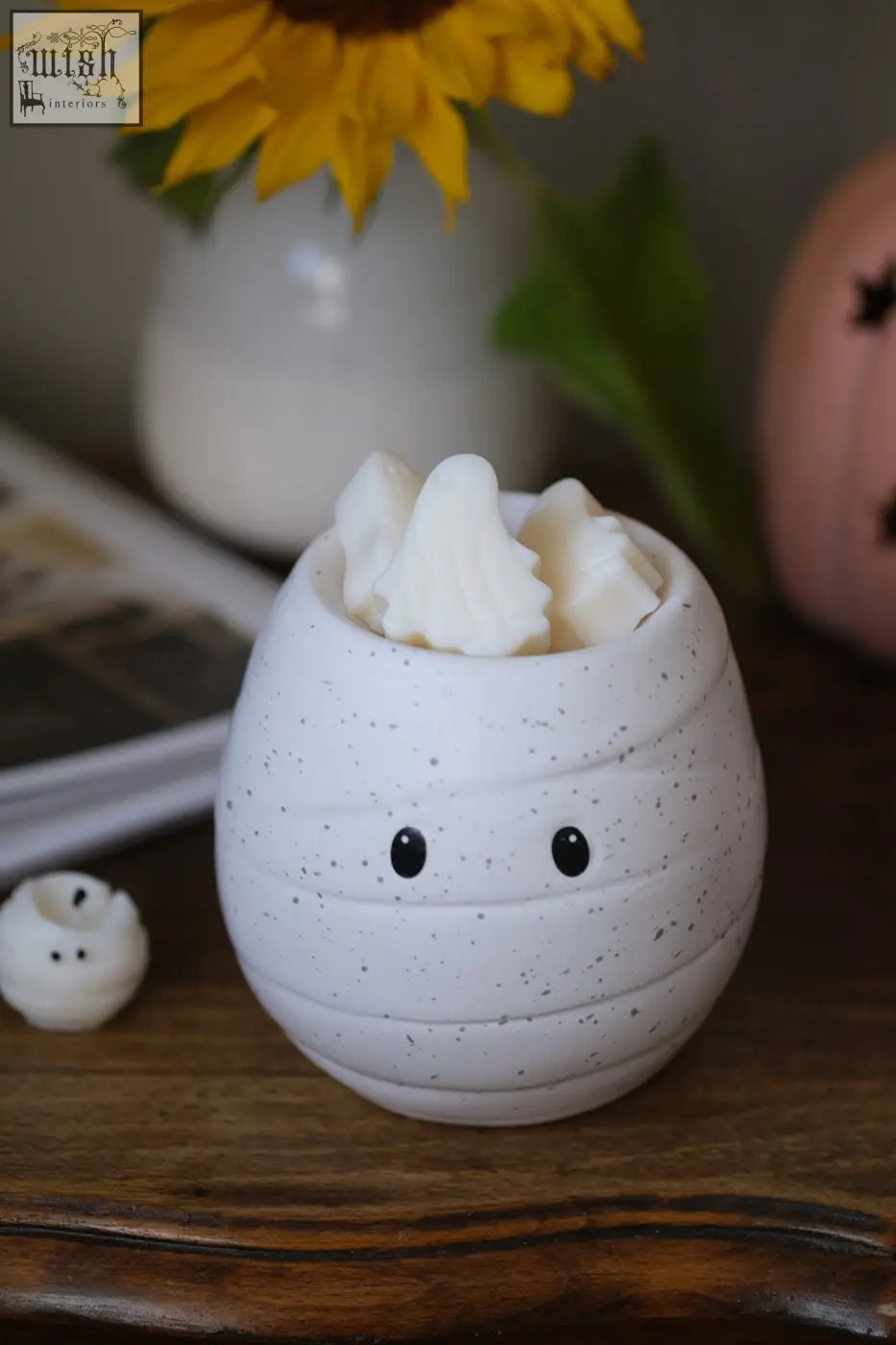 White speckled ceramic mummy shaped wax melt burner with black dot eyes perfect as an oil burner for pumpkin spice fragrance oil