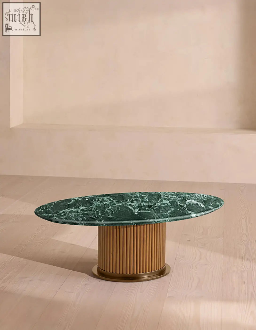 Elegant murcell oval coffee table with brazilian green marble coffee top and light wood slat base with brass accents
