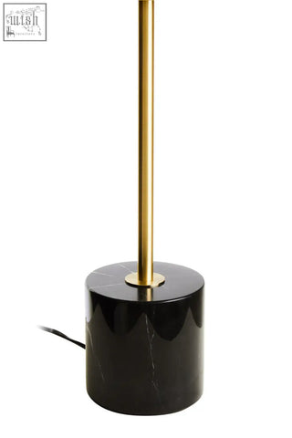 Murdoch brass table lamp with black marble base and polished gold-toned cylindrical stem for stylish lighting