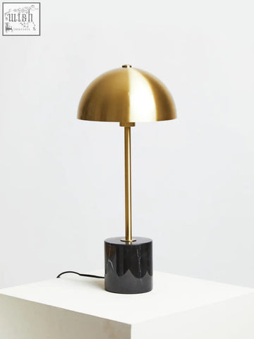 Murdoch brushed brass table lamp with gold dome shade and sleek stem on black marble base for stylish lighting