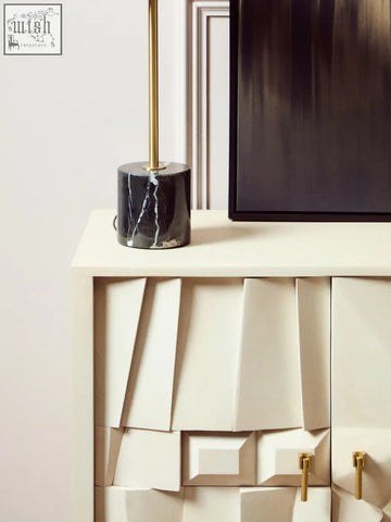Murdoch brass table lamp with a sleek black marble base and polished gold stem for stylish lighting