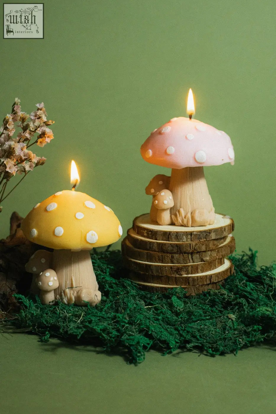 Pink and yellow mushroom family candle with white polka dots made of wax shaped like mushrooms
