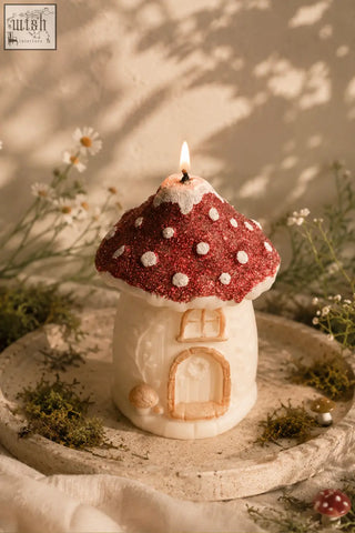 Mushroom house candle with red glittery cap and white polka dots made of natural soy wax with carved details