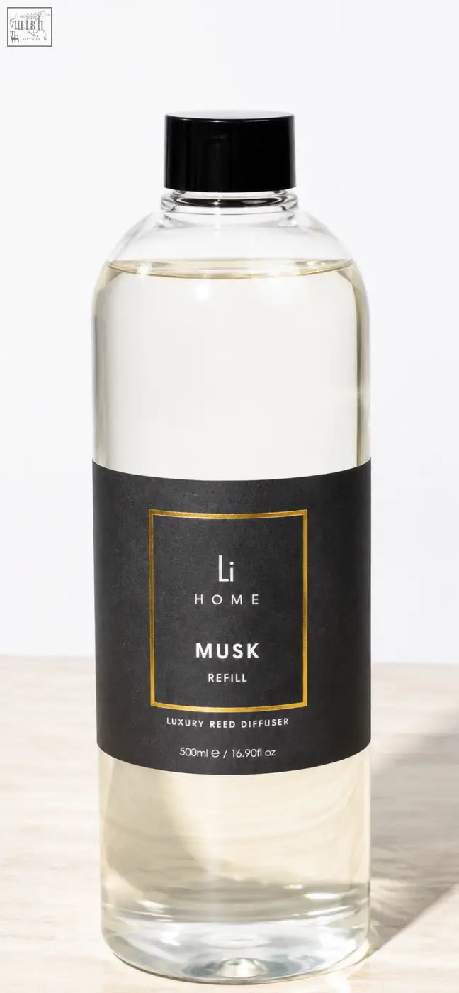Clear glass bottle with black cap and label containing transparent liquid for li home musk square reed diffuser refill 500ml