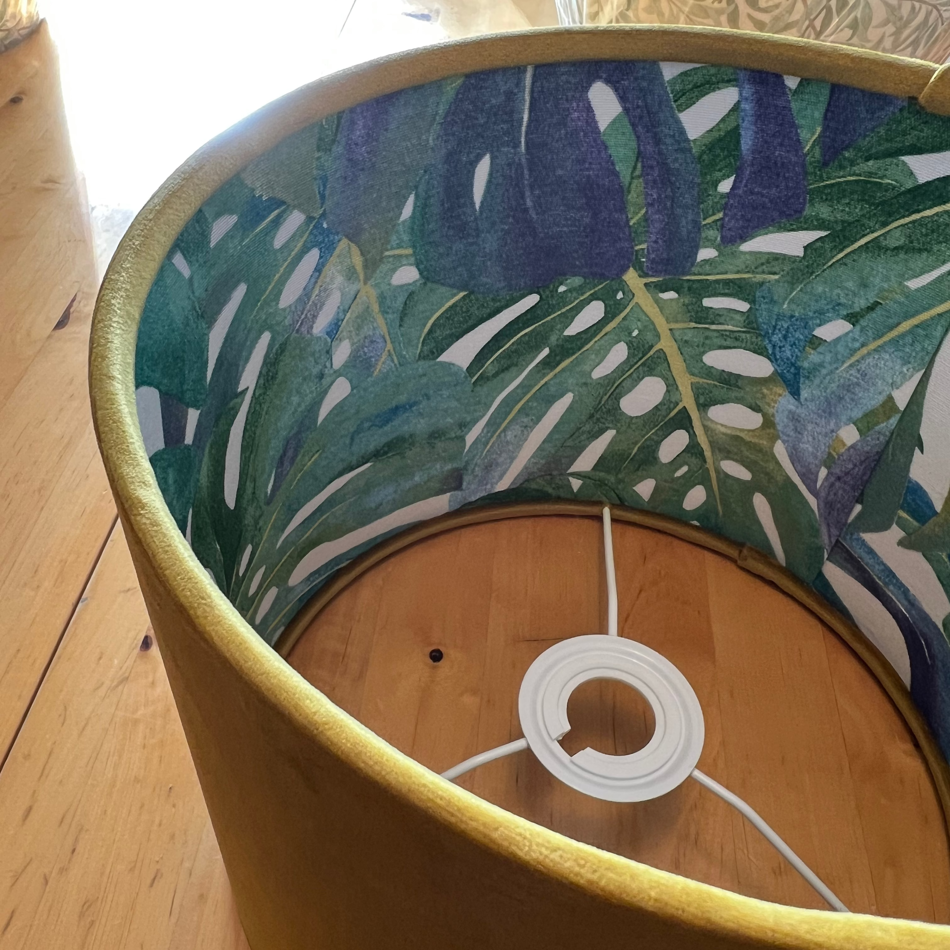 Mustard velvet double sided drum lampshade with vibrant tropical leaf pattern and gold trim for ceiling light shade