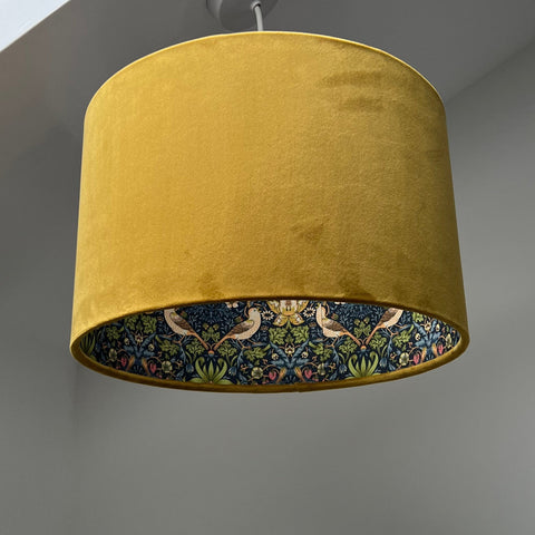 Mustard velvet double sided drum lampshade with navy strawberry thief bird pattern ceiling light shade