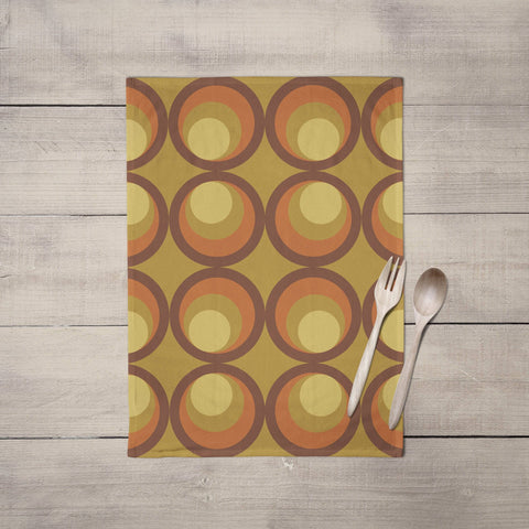 Mustard yellow tea towel with olive green and orange retro circular pattern perfect as a kitchen towel