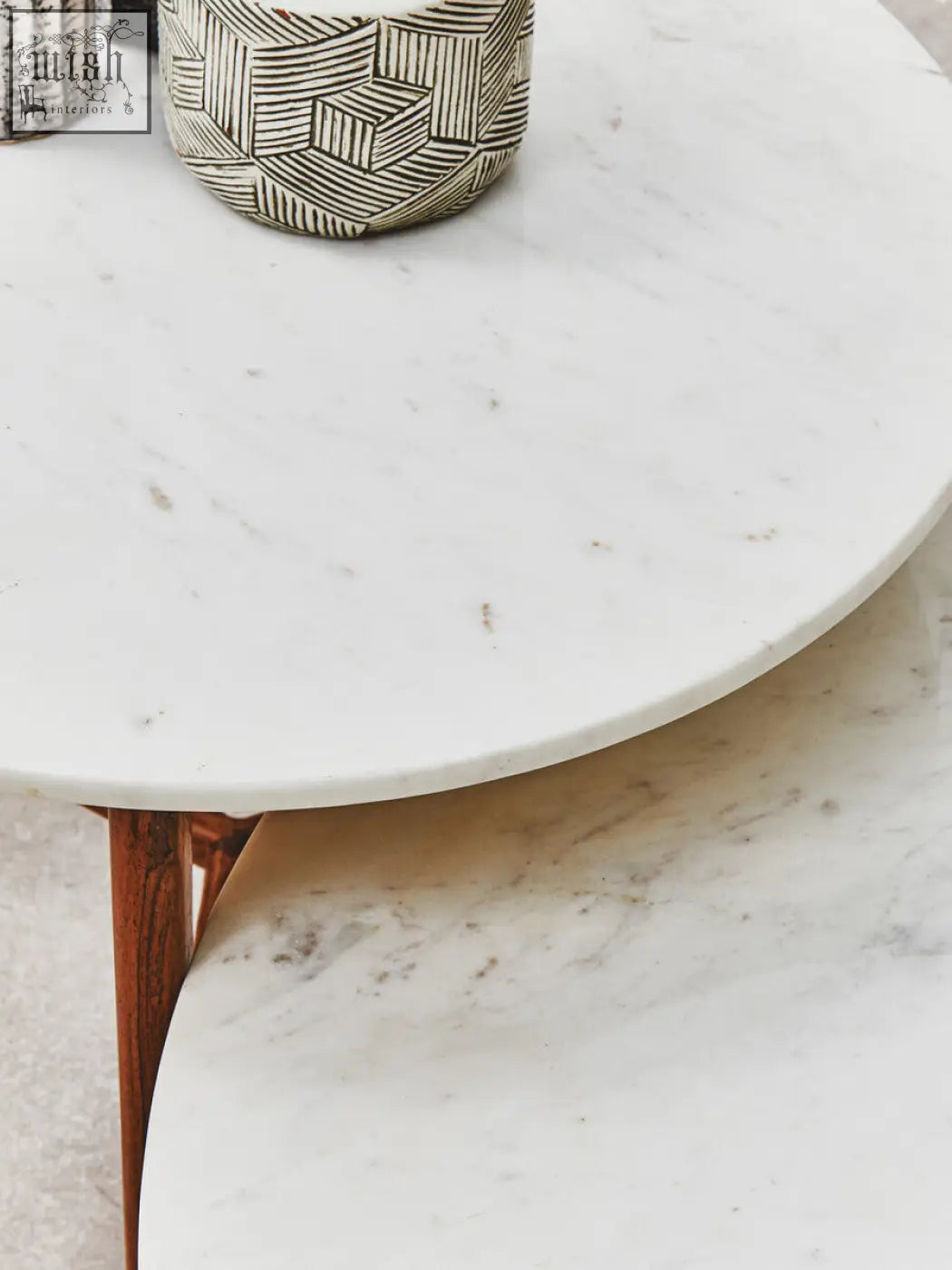 White marble round side table with curved edges and acacia wood legs perfect for stylish living spaces